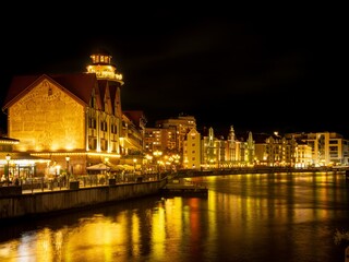 Fototapeta premium The Kaliningrad embankment at night with illumination, Fishing Village