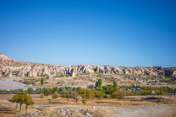 A stunning panoramic view of Cappadocia&rsquo;s iconic valley, showcasing distinctive rock formations and rugged geological textures shaped by centuries of erosion