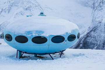 DOMBAY, RUSSIA - 16 January, 2021: Hotel Tarelka (Plate) on upper ski station in Dombay resort in Teberda Nature Reserve in Caucasus Mountains in Karachay-Cherkessia region of Russia in winter