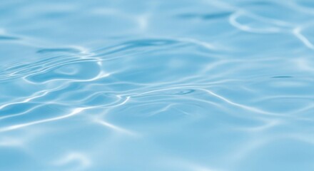 Rippling light on clear blue water surface ripple