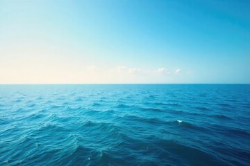 Obraz premium Vast, unbroken expanse of calm ocean meeting the horizon under a clear sky Perfect for travel, serenity, and nature themes A tranquil seascape image , horizon, picturesque