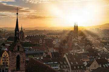 Blick &uuml;ber die D&auml;cher von Basel Richtung Osten. Zu sehen sind die T&uuml;rme der St.-Petri-Kirche, der St.-Martins-Kirche, des Rathauses und des M&uuml;nsters.