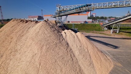 Drying and storage of wood chips in piles. General view of the paper mill. Paper production