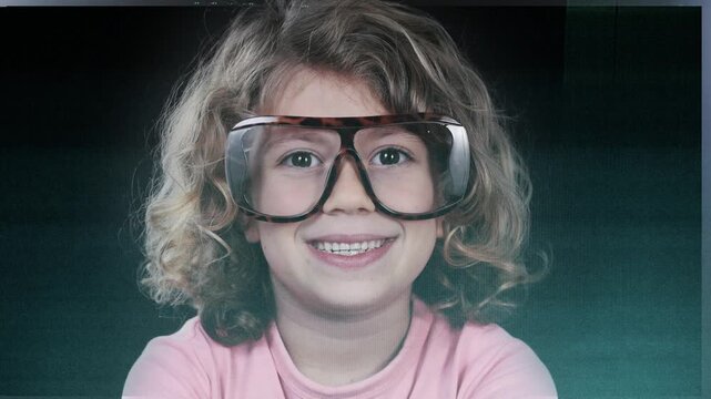 a small girl with glasses with code