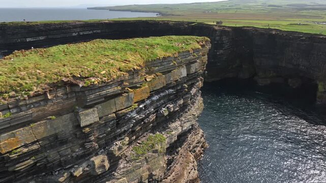 Downpatrick Head in Ireland at Sunny Day, Aerial Drone Shot. Stunning High Cliffs, Dun Briste Irish Coastal Landmark.