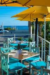 outdoor tables on restaurant by the water