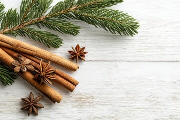 Top-down winter spices with cinnamon sticks, star anise, and pine branch on weathered wood for minimalist farmhouse holiday styling and seasonal decor

