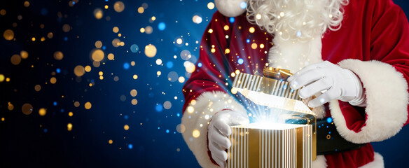 Santa Claus opening a magical Christmas gift box. Holiday present with glowing light and sparkles on a blue bokeh background. Festive winter celebration banner for Christmas and New Year