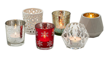 Decorative candle holders with lit tea lights, various styles including mercury glass, red, clear, and ceramic, isolated on transparent background