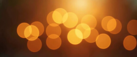 Abstract background of warm orange bokeh lights creating a soft, dreamy effect