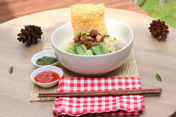 Asian noodles complete with red and green chili sauce