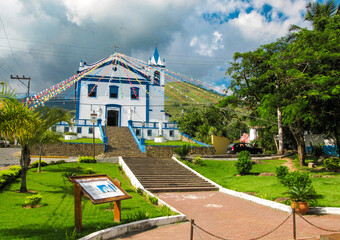 Historic Coastal Chapel with White Fa&ccedil;ade and Blue Doors in Ilhabela, Brazil