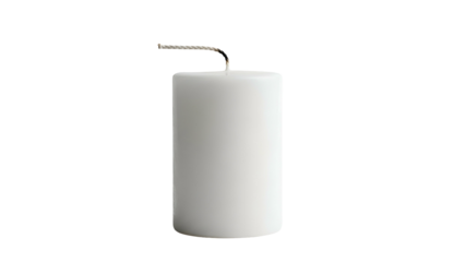 A thick, cylindrical white candle with a lit wick against a stark black background