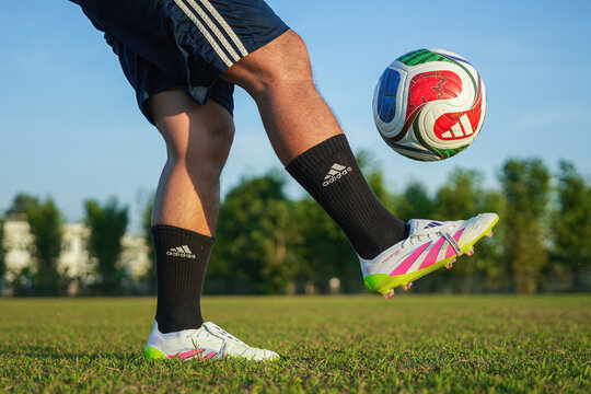 Bangkok, Thailand - 23 November 2025; A football player is training football on training pitch, using "Trionda" the official match ball for FIFA world cup 2026 tournament.