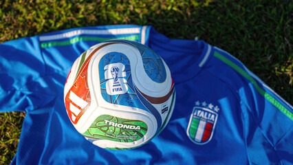 Fototapeta premium Bangkok, Thailand - 23 November 2025; Italy football jersey is placed on football training field with the 