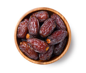 Top view of dates fruit in wooden bowl.
