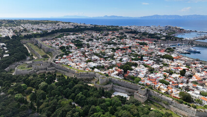 Obraz premium Aerial drone photo of popular for tourists Medieval fortified old town of Rhodes island featuring nice restaurants and ancient sites an Unesco World Heritage, Dodecanese, Greece