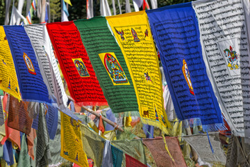 Tibetan prayer flags are colorful rectangular cloth, found along trails and peaks in the Himalayas, used to bless the surrounding countryside and paths.