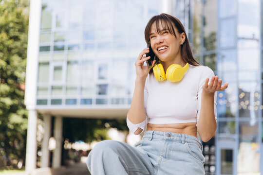 Happy woman talking cell phone making call - Powered by Adobe