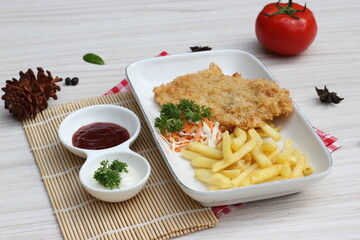 French fries and large chicken with delicious sauce