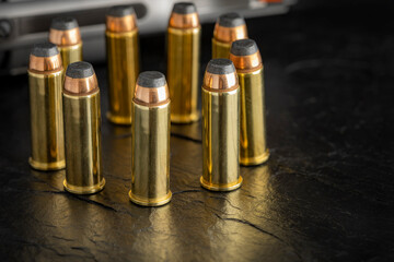 Ammunition of .44 magnum on black background , Bullets of pistol handgun