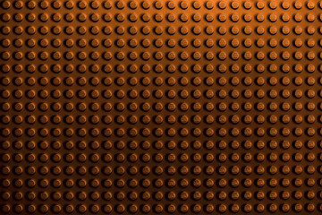 Obraz premium Warm Brown or Copper LEGO Brick Surface Texture Background