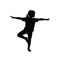 Child performing yoga tree pose silhouette