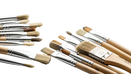 Close-up of various clean, new, flat and round paintbrushes against a black backdrop