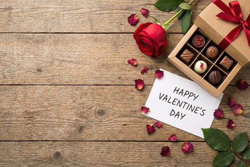 Valentine's day concept with rose, chocolates, and greeting card