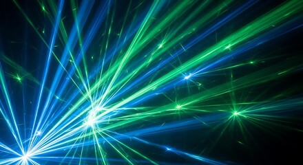 Vibrant blue and green laser beams create a dynamic and energetic light show, illuminating a dark space with a futuristic and abstract glow, perfect for backgrounds and events