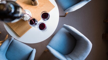 decanting. An elegant dining scene featuring red wine in crystal glasses on a sophisticated table setting. bar promotions, beverage menus, designed for product packaging and bar promotions.
