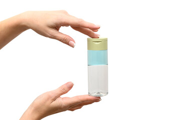 Female hands holding a makeup remover. On a white background.