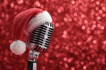 Microphone with Santa Claus Hat and Red Festive Backdrop