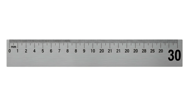 Metallic, straight 30 cm ruler with black markings and numbers, isolated on a black background