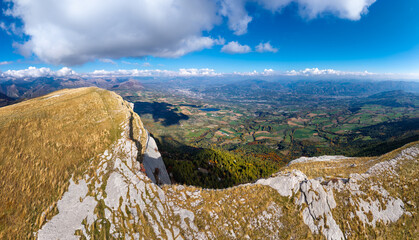 Aerial panoramic view of the limestone cliffs and plateau of Ceuze near Gap, Hautes-Alpes, France. Mountain ridge overlooking the Gap basin and the Southern Alps