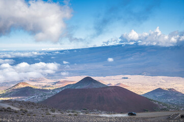 Steep volcanic ridge and summit trail above the clouds on the upper slopes of Mauna Kea, Hawaii Island, USA