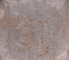 The background is old metal with scratches