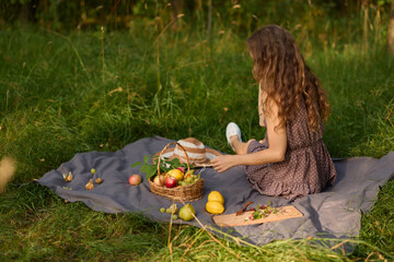 Peaceful scene depicting woman resting on blanket amid nature and sunlight