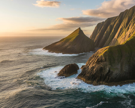 Rugged green coastal cliffs meet crashing ocean waves at sunset image - Powered by Adobe