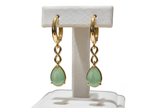 Elegant gold dangle earrings featuring pear shaped light green gemstone drops isolated on transparent background