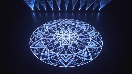 Mesmerizing light projection unveils an intricate glowing mandala pattern, creating a captivating visual art experience on a dark stage, blending technology and artistic design