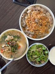 Hearty noodles and soup shared among diners.