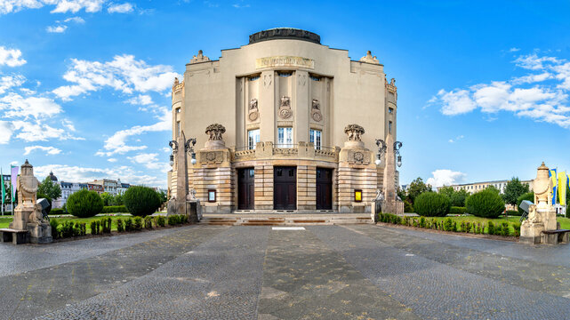 Art nouveau architecture of Cottbus Theater with sculptural details and lawn