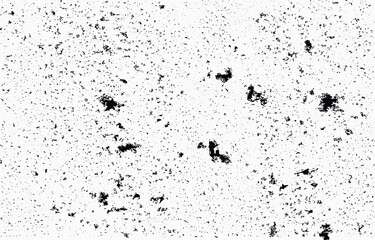 Abstract grunge vector design featuring a textured pattern of dark spots and random marks set against a white background for use in various creative projects