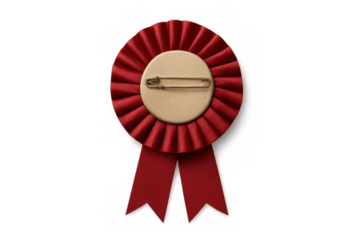 Red rosette award ribbon displaying round blank backing and safety pin, symbolizing achievement, recognition, and success