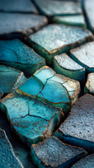 Macro abstract of cracked blue surface with rough edges. Textured backdrop shows weathering and unique geological formations.