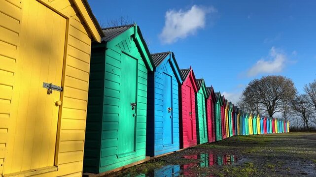 Brightly Colored Beach Huts at Llanbedrog, Cardigan Bay, Llyn Peninsula, Gwynedd, North Wales, United Kingdom