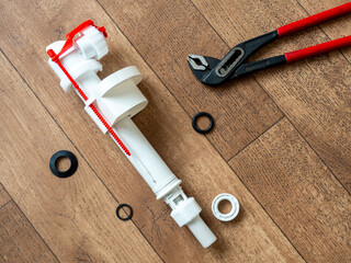 Toilet cistern repair. Flush box inlet valve   with bottom connection. Intake mechanism with lower connection 