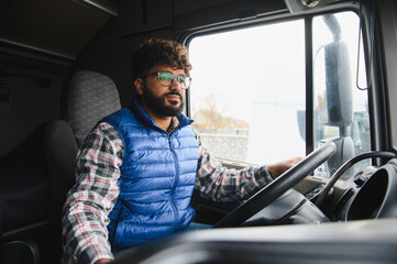 Indian truck driver transporting goods on road