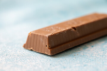  Close-Up of Pistachio Chocolate on Blue Background
